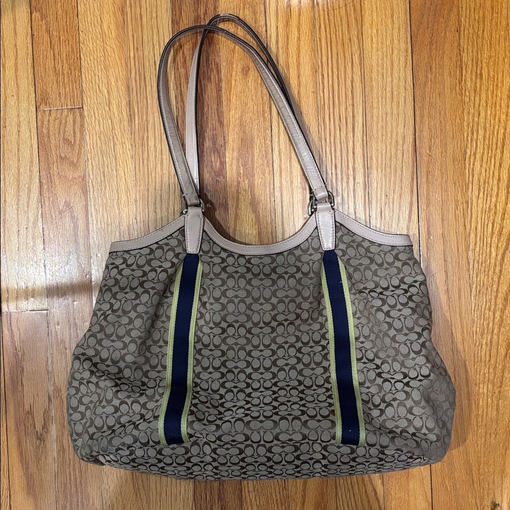 COACH signature Cs with navy and bright yellow/green stripe